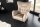 Fauteuil à oreilles velours beige crème avec accoudoirs Chesterfield